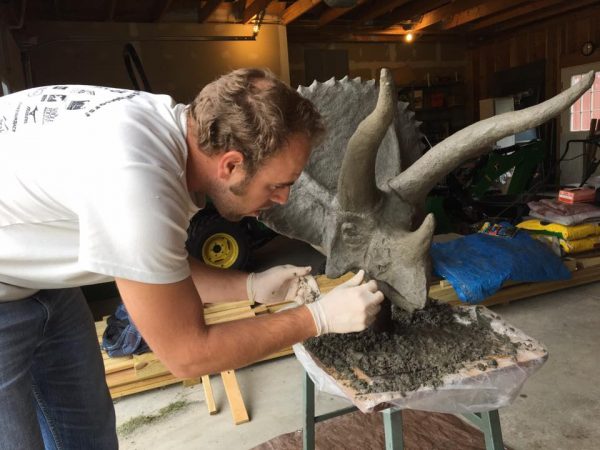 Adding details to the ferrocement triceratops head.