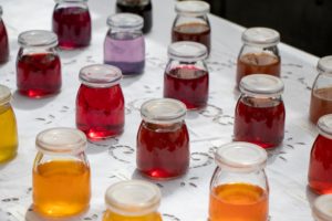 Jars of watercolor pigments in the Colors of Blake Garden Art Exhibition